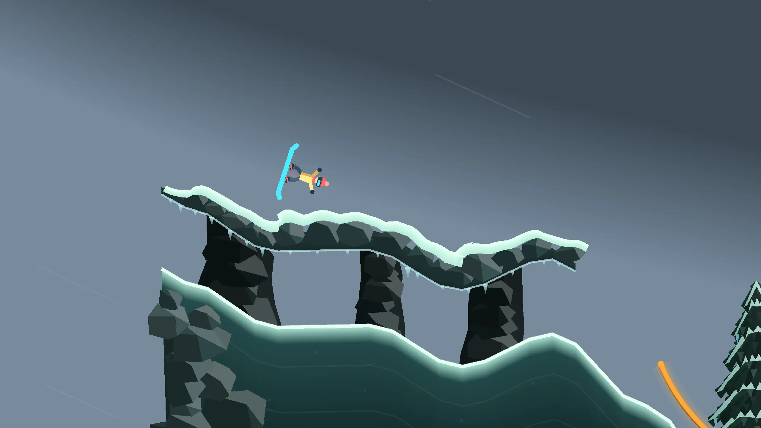 A snowboarder flipping upside down above a snow-capped rock arch
